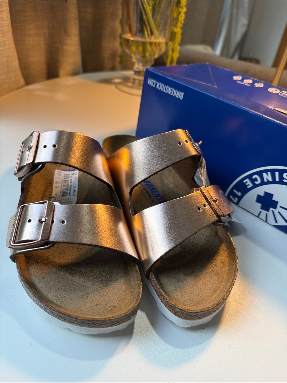 Birkenstock women’s Arizona Two-Strap Sandals in Metallic Rose